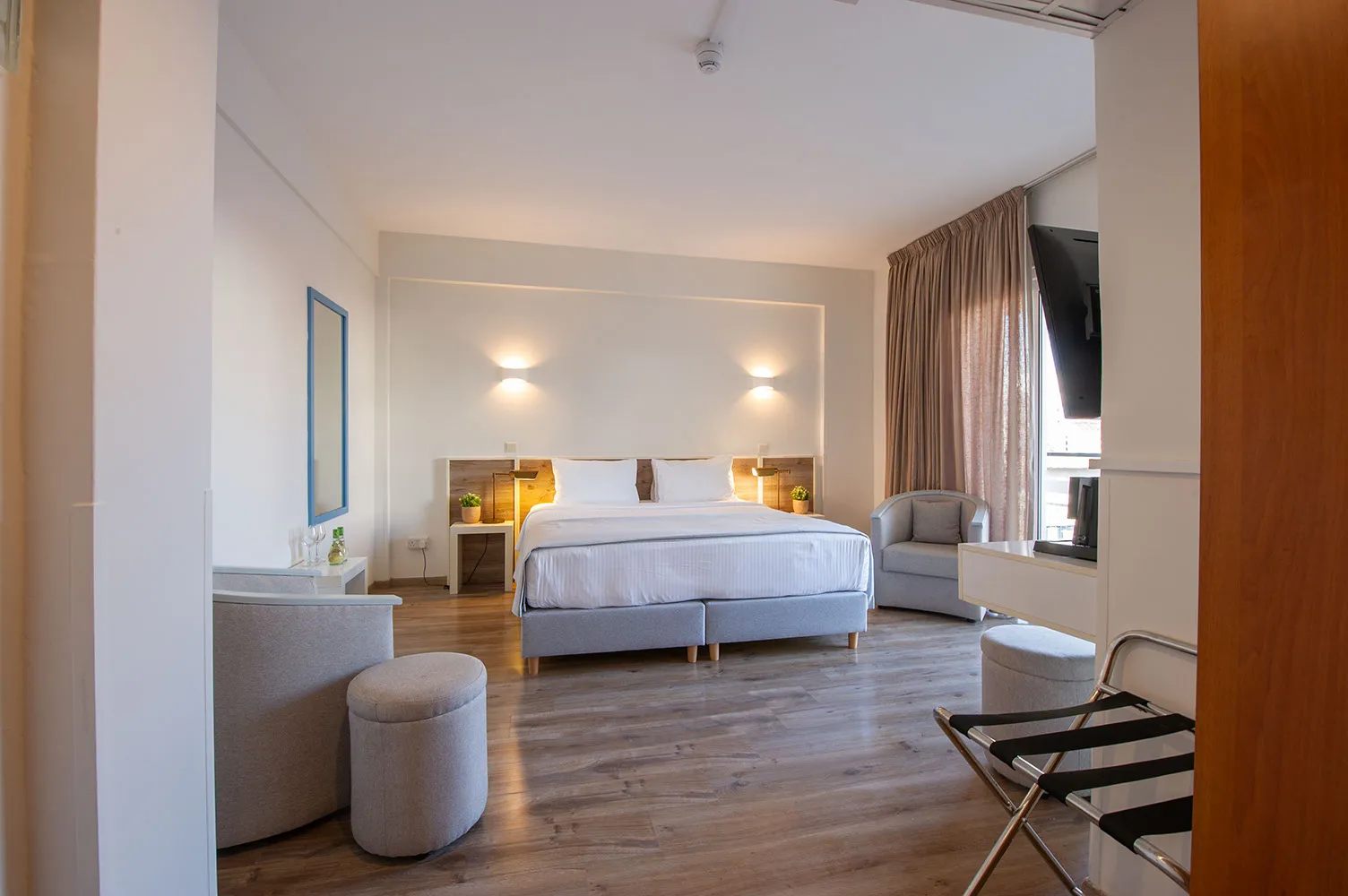 Large room with sofa and beds